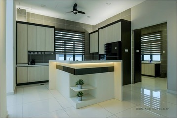 Elegant contemporary kitchen designed by ICONFACTORY SDN BHD, from their 'Wira Mutiara at Bandar Sungai Long' collection, showcasing sleek beige cabinetry, modern appliances, and a minimalist island with a pop of greenery—exemplifying a modern and sophisticated home interior.