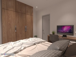 This R Works-designed bedroom, featured in the RIMBAYU album, showcases a modern contemporary style with a warm, minimalist atmosphere. Strategically integrated within the space are clean lines, a neutral color palette of whites and beiges, and an emphasis on natural wood textures. The streamlined furniture and smart placement of lush greenery complement the room's serene vibe, while the sleek computer on the desk hints at functionality within this tranquil retreat.
