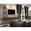 This elegant living room by R Works showcases a contemporary modern design, part of their RIMBAYU album. The space is beautifully coordinated with neutral tones and pops of green, featuring sleek furniture with clean lines, a textured wall accent, and flowing dark curtains. Strategic lighting and plush textiles create a cozy yet sophisticated atmosphere, perfect for those seeking stylish and comfortable home decor inspiration in Malaysia.