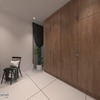 This modern interior by R Works exudes contemporary elegance with a minimalist vibe, featuring a sleek wood-finished wardrobe that dominates the space. The bold contrast of dark hues and white flooring adds depth, whilst the pops of yellow home decor inject vibrancy into the room. A strategically placed indoor plant introduces a touch of greenery, enhancing the room's fresh and sophisticated ambiance, perfectly encapsulated in the RIMBAYU album.