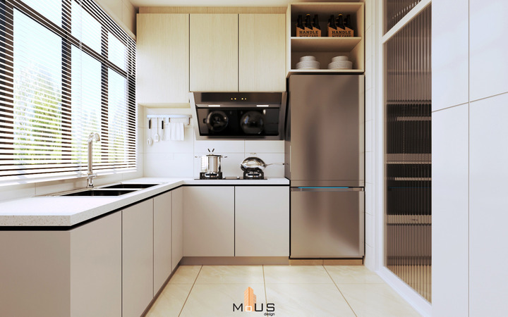 This sleek kitchen from MOUS DESIGN’s KLANG HOUSE album showcases contemporary elegance with a modern aesthetic. Featuring clean lines, a monochromatic color palette with cream cabinetry, and stainless steel appliances, the design optimizes natural light through stylish window blinds. Strategic lighting accents the functional workspace, encapsulating the album's sophisticated "Design & Built" approach, ideal for those inspired by Malaysian interior design trends.